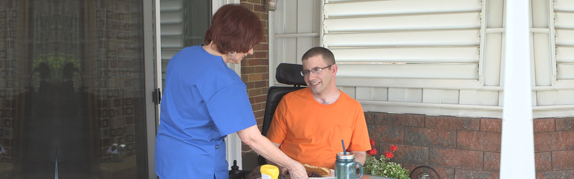 Happy caregiver and old woman