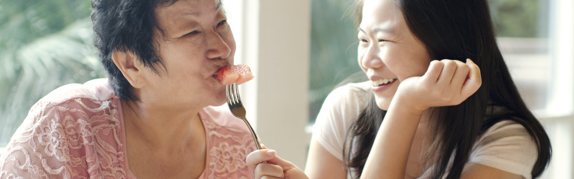 Smiling nurse and old woman